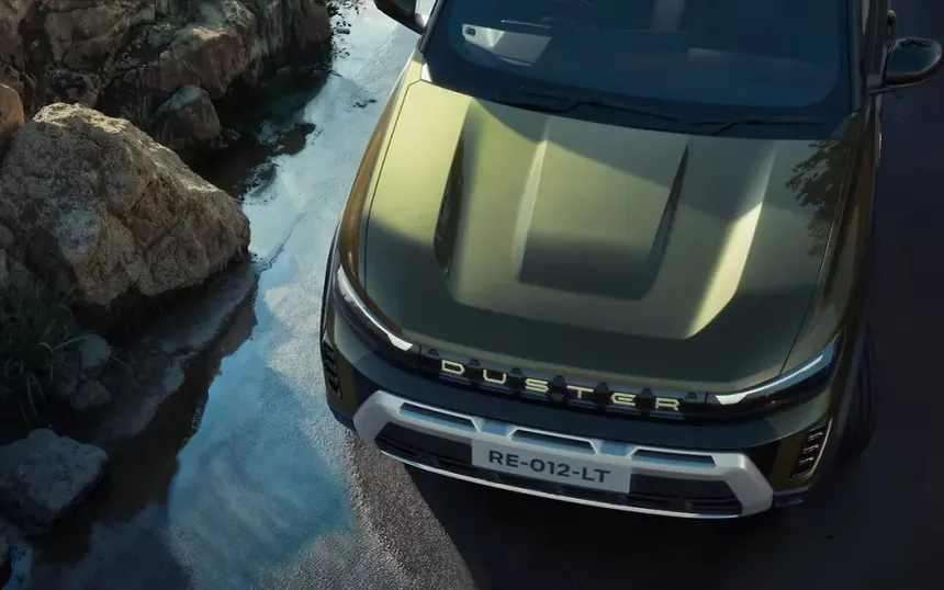 Modern boxy SUV driving on rugged mountain trail