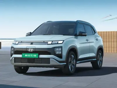 Hyundai electric crossover driving on mountain road